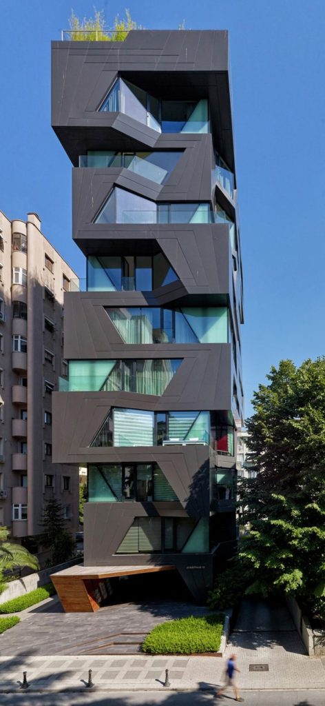 The exterior of this apartment building is a break from the construction of the cookie cutter ...