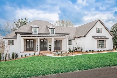 Discover countless photos of this elegant house. Our favorite part? The brick accent