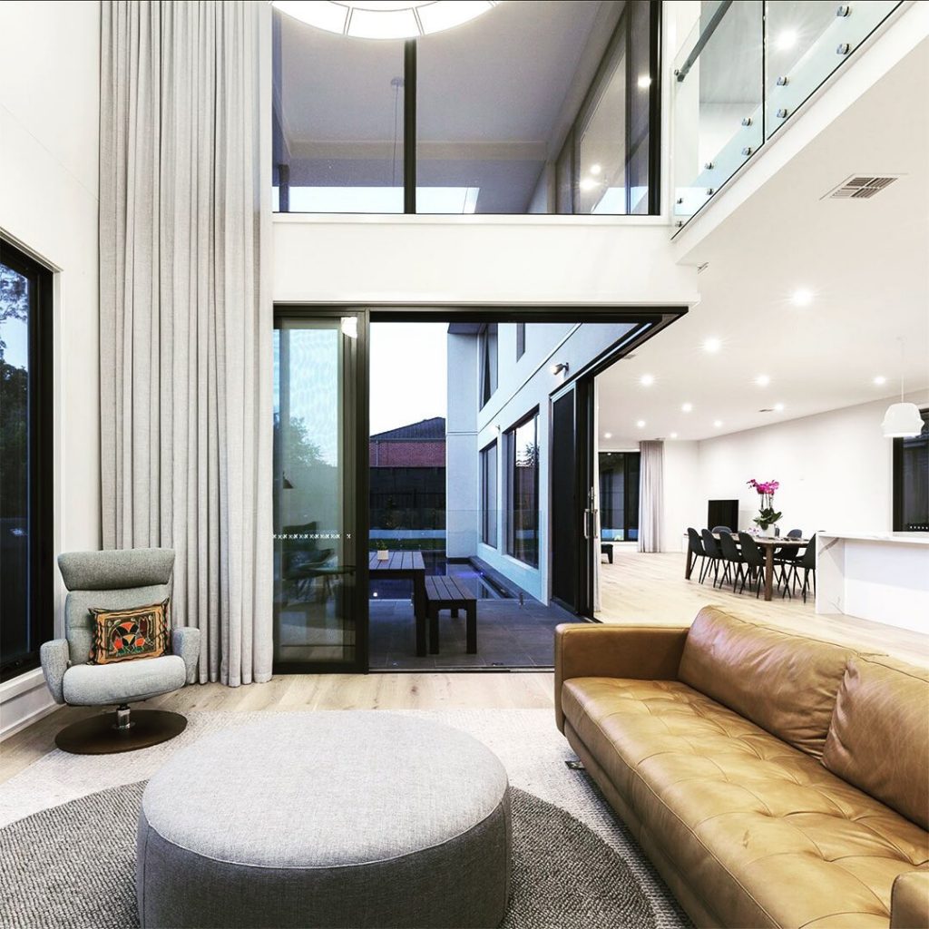 A double-height cavity in the family living room gives a sense of size