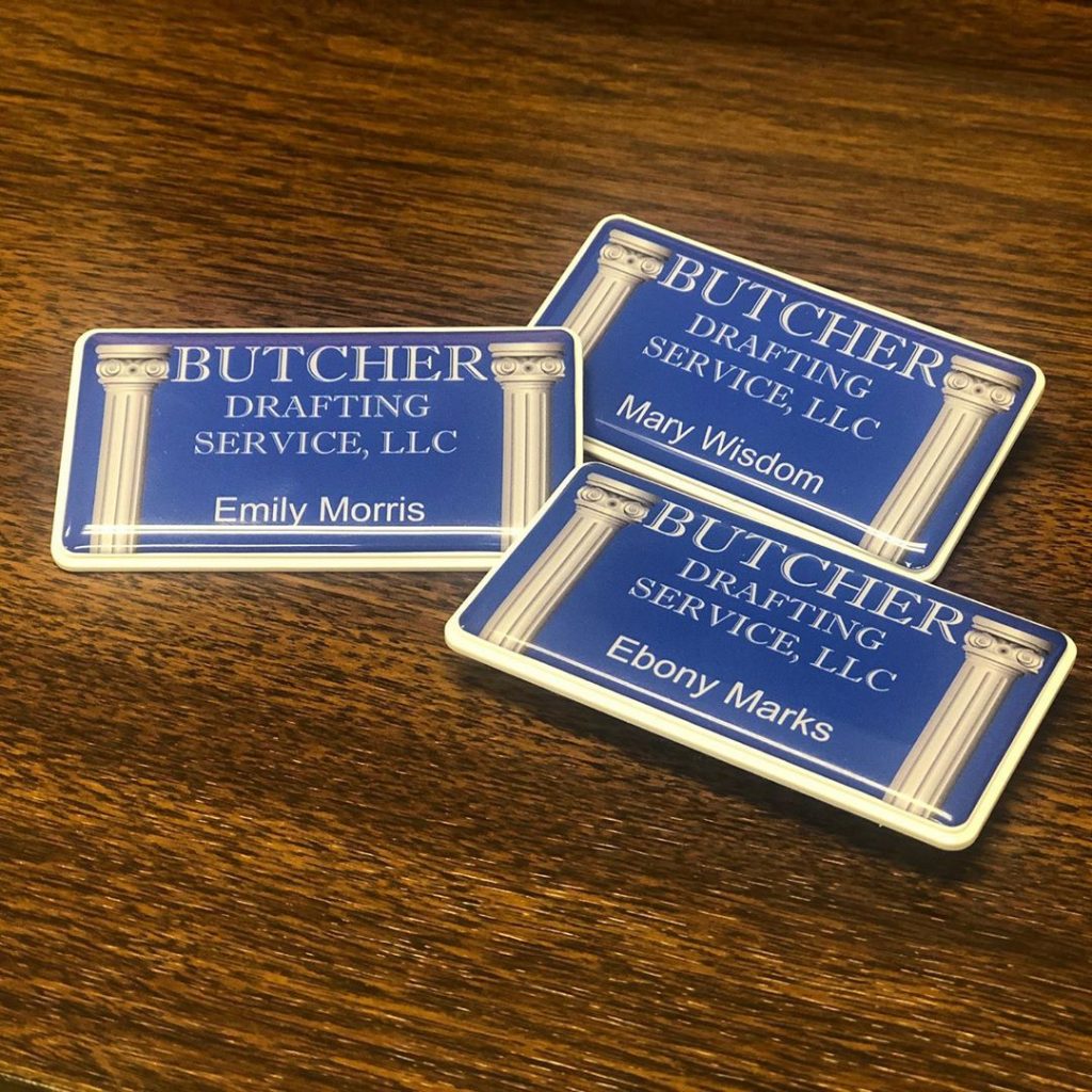 Take a look at our new name badges! Now, when we go to measure and market appointments